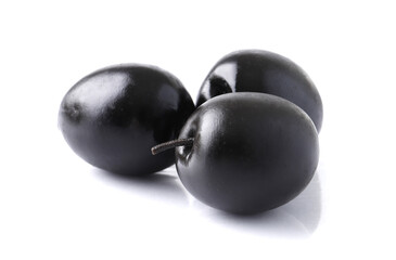 Black olives with pits on white background