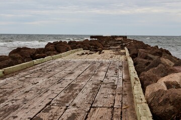 An old pier leads out into the Atlantic Ocean in North Rustico, PEI. 
