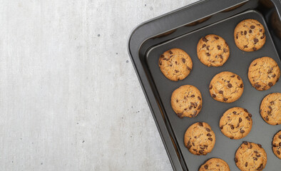 Chocolate chip cookies on a baking tray with copy space - Powered by Adobe