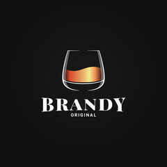 Brandy glass logo. Golden whiskey or cognac