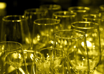 Many empty wine glasses on the bar counter. Wine glasses on blurred background. Lack of clinets covid 19