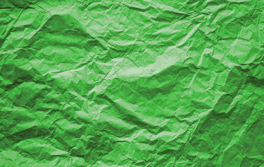 Crumpled green thin design paper. Flat lay background. Gift wrap. Birthday, 8th of march, Valentine's day.