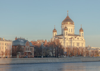 Fototapeta na wymiar Christ The Saviour Cathedral in Moscow Russia. Prechistenskaya embankment. Sunny morning, winter