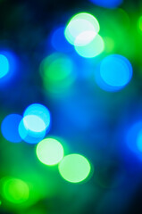 Obraz premium Abstract pattern of colorful bokeh lights on dark background