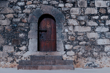 Fototapeta na wymiar Image of external door of an old castle on the island of Lanzarote. Canary Islands.