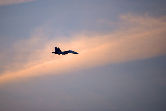 Moscow region, Kubinka,  Russia - March 11, 2015: Russian fighter Sukhoi Su-27 of an aerobatic demonstration team of the Russian Air Force "Russian Knights" (Russkiye Vityazi) in flight.