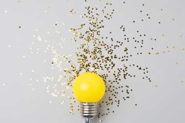 One yellow decorative lamp on a gray background.