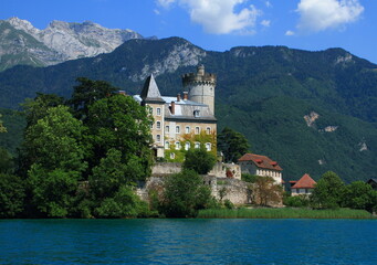 Fototapeta na wymiar Editorial usage. Medieval castle in an small island on Annecy lake France Savoy Saint Bernard, summer 2011