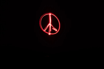 red peace sign light painting