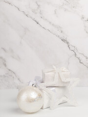 Christmas composition. Christmas toys gifts on a white marble background