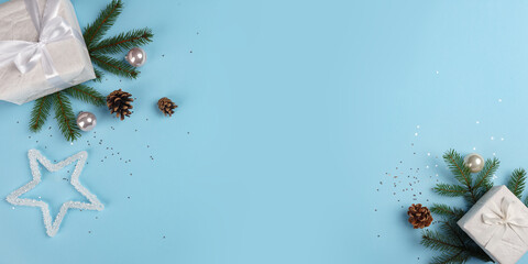 A Christmas card. Boxes with gifts of Christmas decorations on a blue background. Horizontal Christmas card