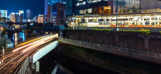 Trains pass through Ochanomizu train station in Tokyo, Japan