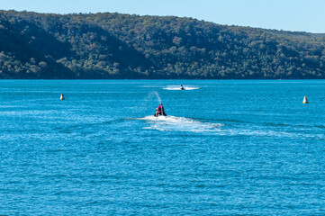 Naklejka premium Summer Day with Jet Skis on the Bay