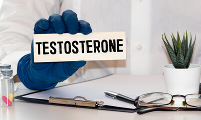 Medical concept. Top view of stethoscope and syringe with notebook written with TESTOSTERONE on...