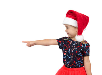 Smiling little girl in Santa hat points finger isolated on white background.