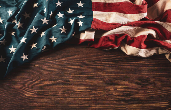 Martin Luther King Day celebrated concept. American flag on old wooden background