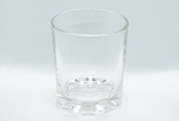Glass on light background with selective focus