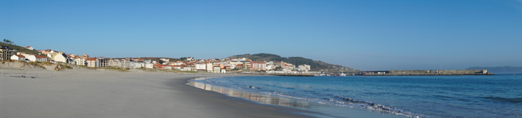 Fototapeta na wymiar panorama banner view of the beach and Galician town of Laxe in northern Spain