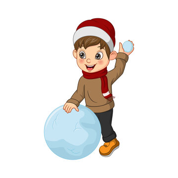 Cute little boy in winter clothes playing a snowball