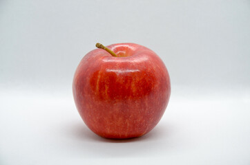Fresh one red apple isolated on light background