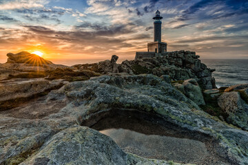 beautiful sunset at the Punta Nariga lighthouse in Galicia