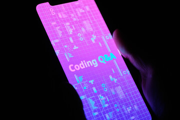 Concept FAQ of programming language questions and answers on smartphone display