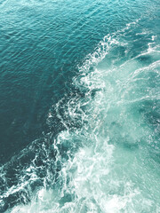 Fototapeta na wymiar Blue water with foam waves. Deep sea. Peaceful ocean/ Abstract natural background.