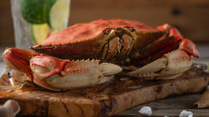 Macro shot view of cooked crab on wooden board background. Delicious meal. Seafood concept. View from above. Space for text.