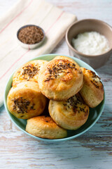 Close up view on Cheese Bannocks in plate on rustic wood table