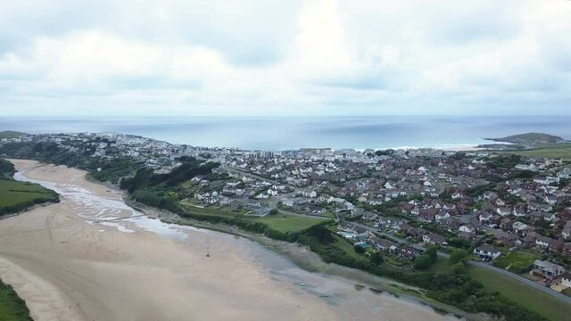 Panoramic View Of Newquay Town Under Bright Sky From River Gannel At Daytime In Cornwall, England, UK. - aerial panning