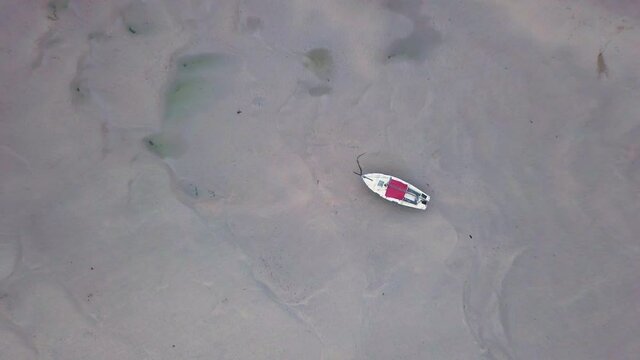 Boat On Shallow Water Of Gannel River In Newquay United Kingdom. - Aerial Ascending