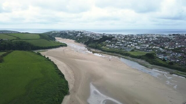 River Gannel During Low Tide Between Newquay Town And Crantock Green Hills In England, United Kingdom. - aerial ascend