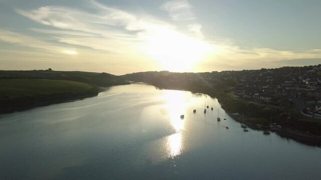 Beautiful Sunrise Reflecting On Calm Water Of River Gannel During Summer In Newquay, England, UK. - aerial
