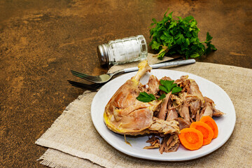 Boiled chicken meat with carrot and parsley