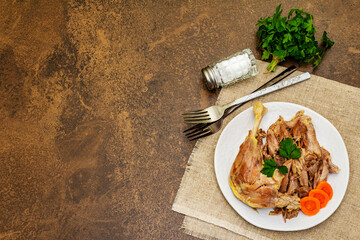 Boiled chicken meat with carrot and parsley
