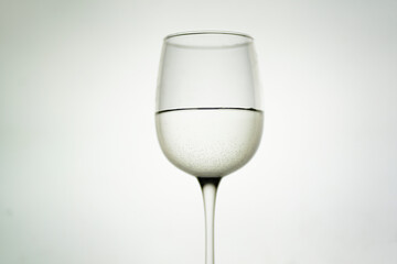 glass of champagne wine glass filled with Sparkling white wine on white background