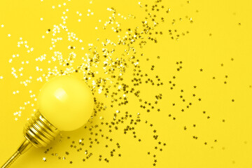 One yellow decorative lamp on a gray background.