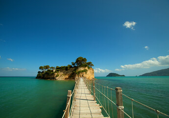 Fototapeta premium The wooden footbridge leading to the small island of Agios Sostis on Zakynthos, Greece