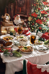 Festive table with traditional Christmas Eve dishes