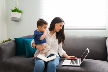 Single mother with baby working from home