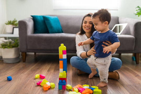 Mom and child playing with toy bricks