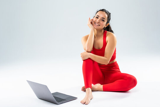 Girl Makes Yoga Exercise Online With Laptop Isolated On The White Background