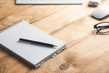 notepad with computer and earphone