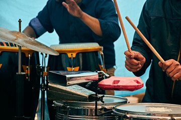 hands and the percussion section at a symphonic concert