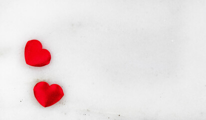 Two red lovely hearts on marble stone for Valentines Day