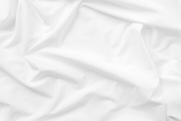 Fototapeta premium Abstract white fabric texture background. Cloth soft wave. Creases of satin. silk and cotton.
