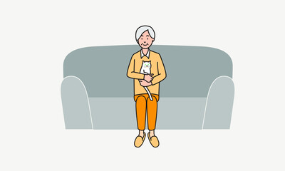 猫を抱いてソファに座る老人