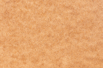 wood background: light brown pressed wood fiber board. hdf stove