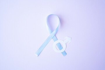 Prostate cancer awareness blue ribbon with white paper male sign mars arrow on pink background. Men healthcare concept, men carcinoma symbol. © Quils