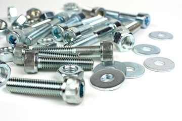 on a white background galvanized metal fasteners close up